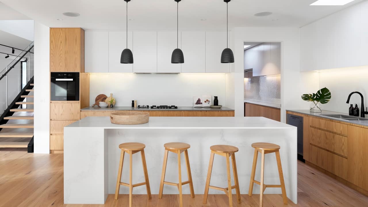 A new kitchen with custom cabinetry and an island