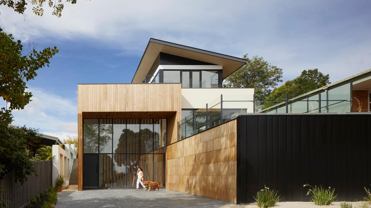 A modern house with large new windows and doors