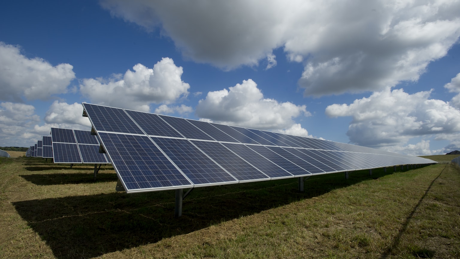 A ground-mounted solar array under a clear sky