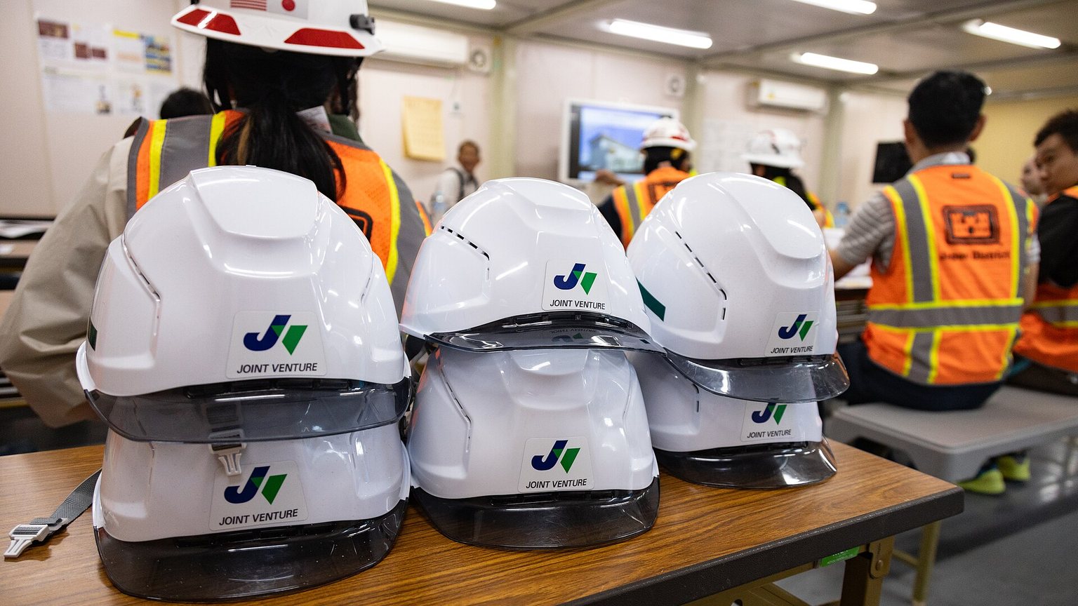 Construction project manager reviewing drawings on a job site