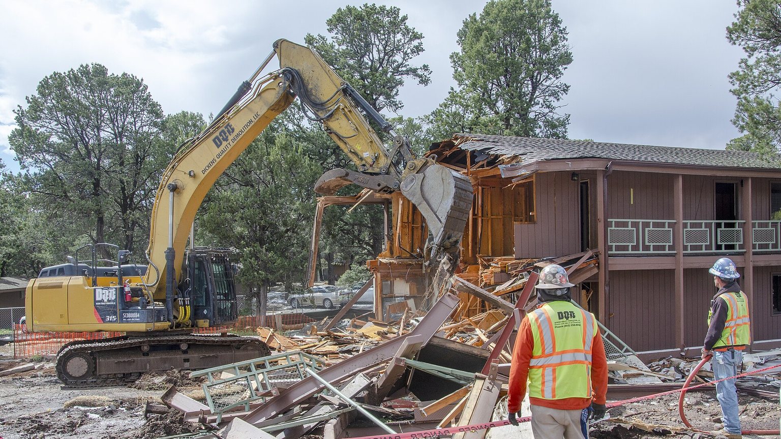 Site supervisor and workers reviewing a project on a construction site