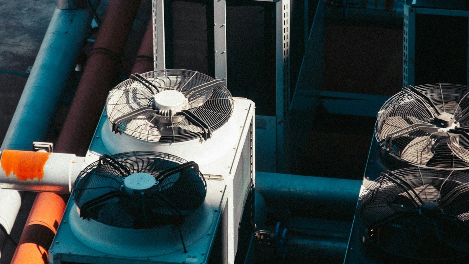 Rooftop mechanical equipment and ductwork on a South Florida commercial building