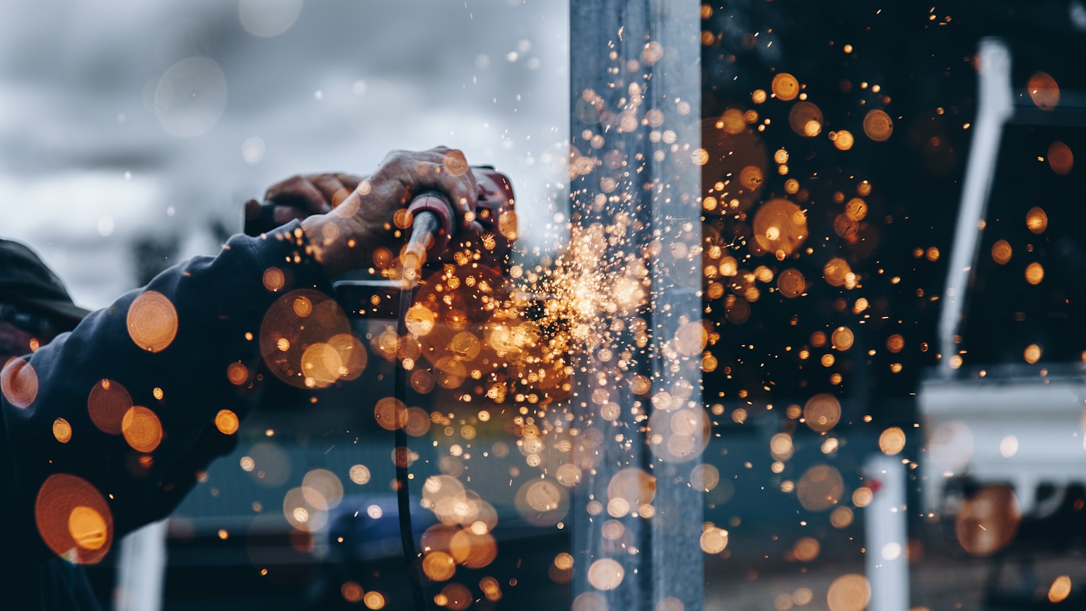 Sparks flying from metal work on a construction site